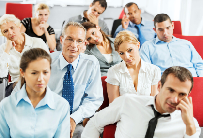 Exhausted businesspeople on a seminar.